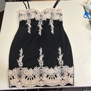 Black dress with white embroidery